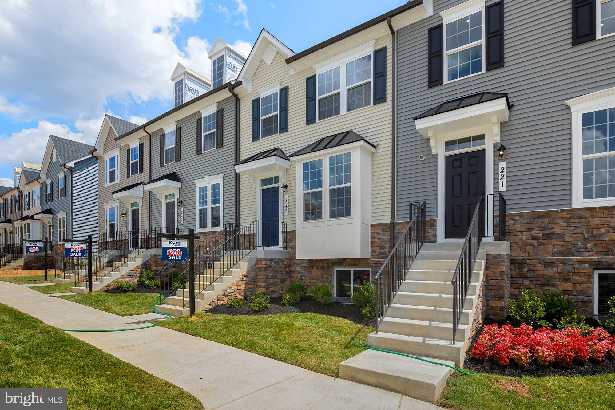 221 Edwin Road Frederick, MD 21702 - Photo 3 of 36 a front view of a house with a yard and garden