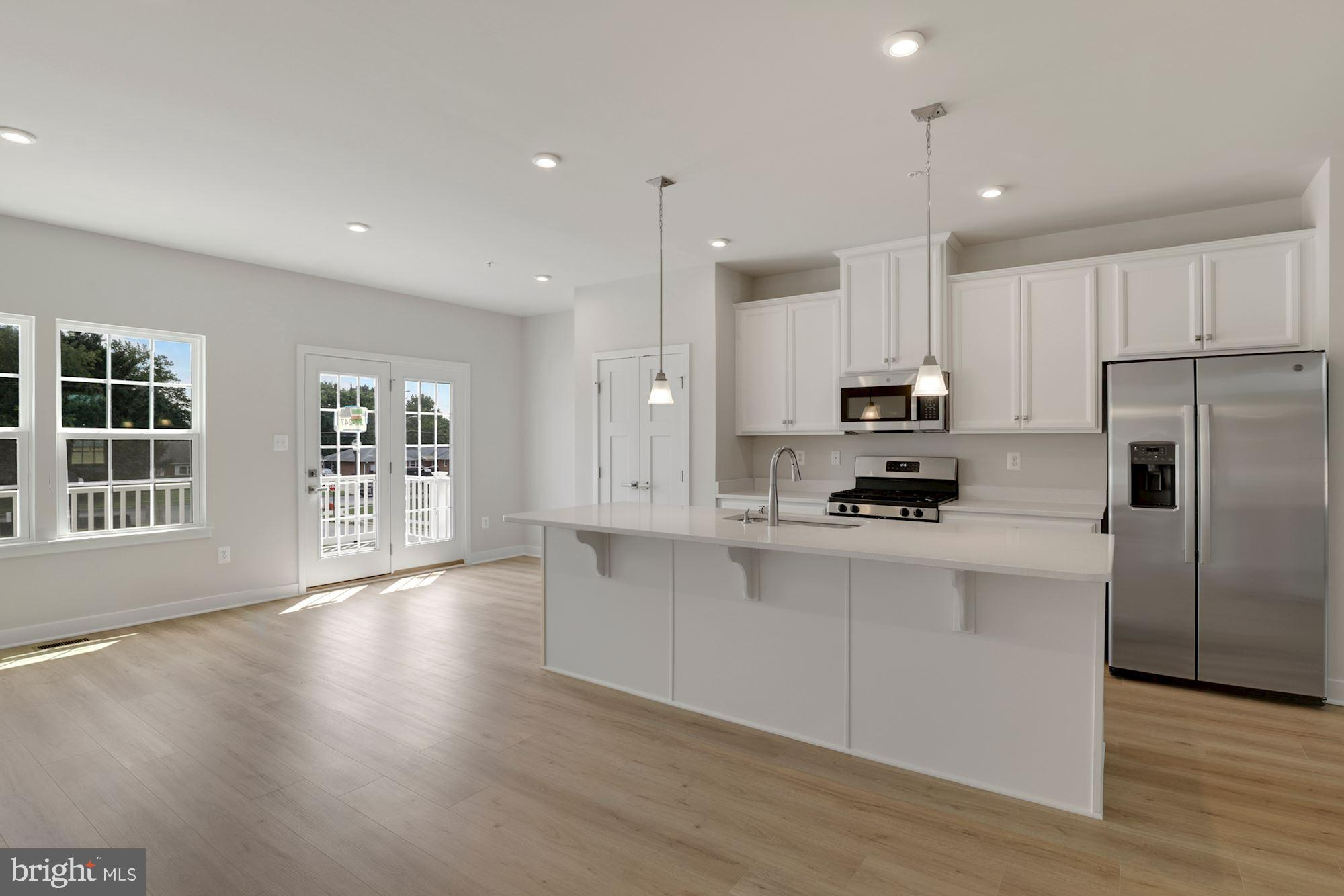 221 Edwin Road Frederick, MD 21702 - Photo 8 of 36 a kitchen with stainless steel appliances a refrigerator sink and microwave