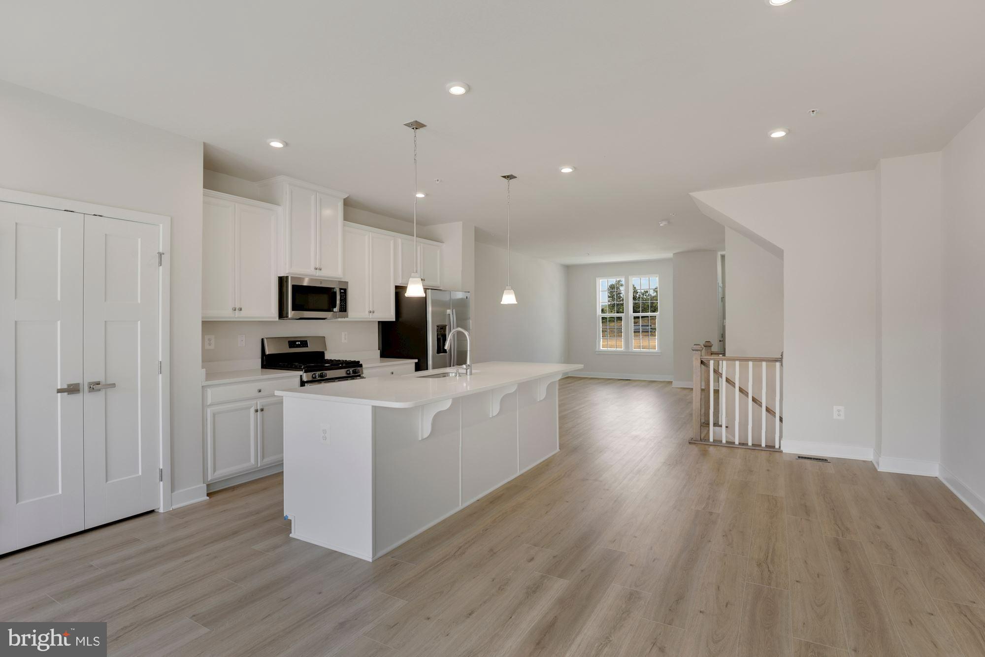 221 Edwin Road Frederick, MD 21702 - Photo 9 of 36 a kitchen with stainless steel appliances a refrigerator and a stove top oven