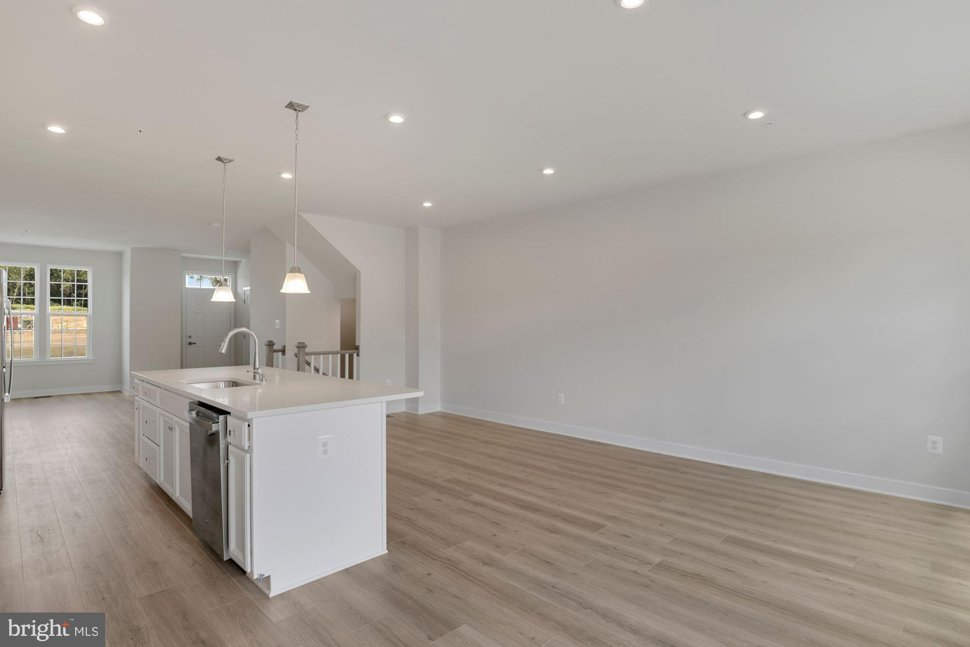 221 Edwin Road Frederick, MD 21702 - Photo 10 of 36 an open kitchen with a sink and a stove top oven