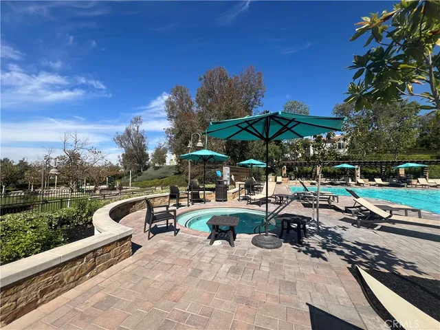 a view of a patio with chairs and a table