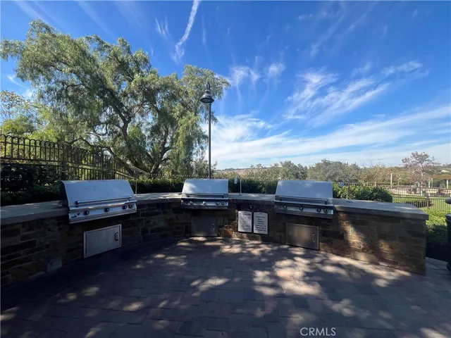 a view of a patio with a table and chairs