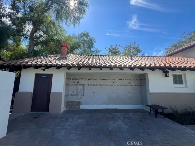 a view of a swimming pool and lounge chairs