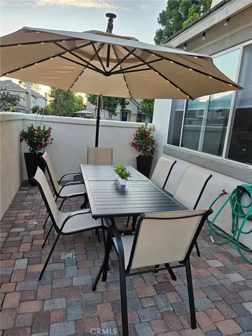 a view of a swimming pool with sitting area