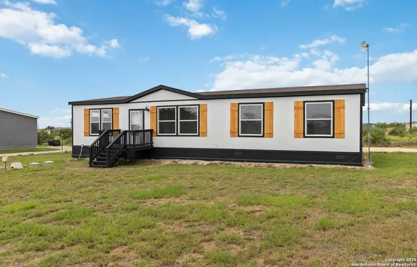 a view of a house with swimming pool