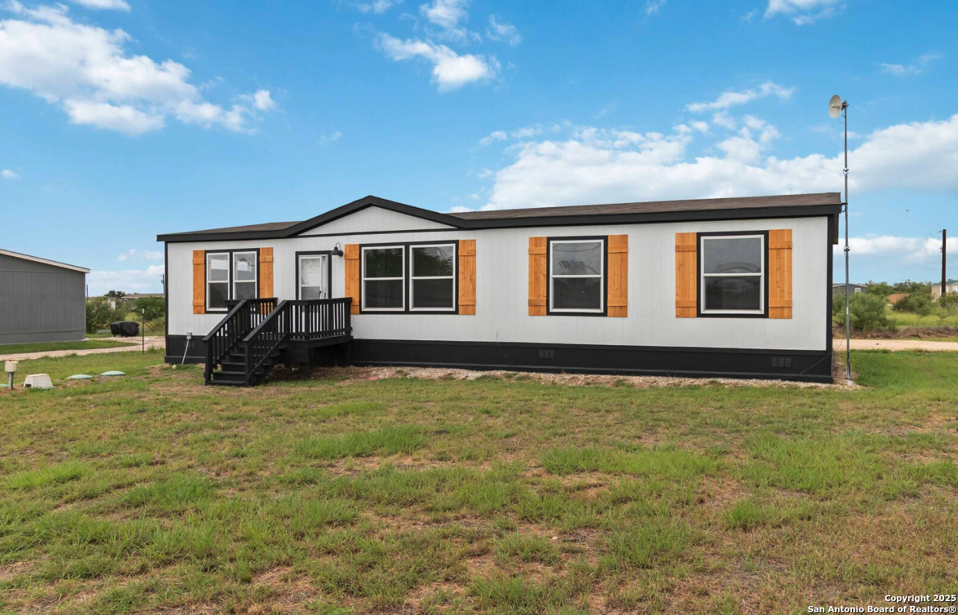 a view of a house with swimming pool