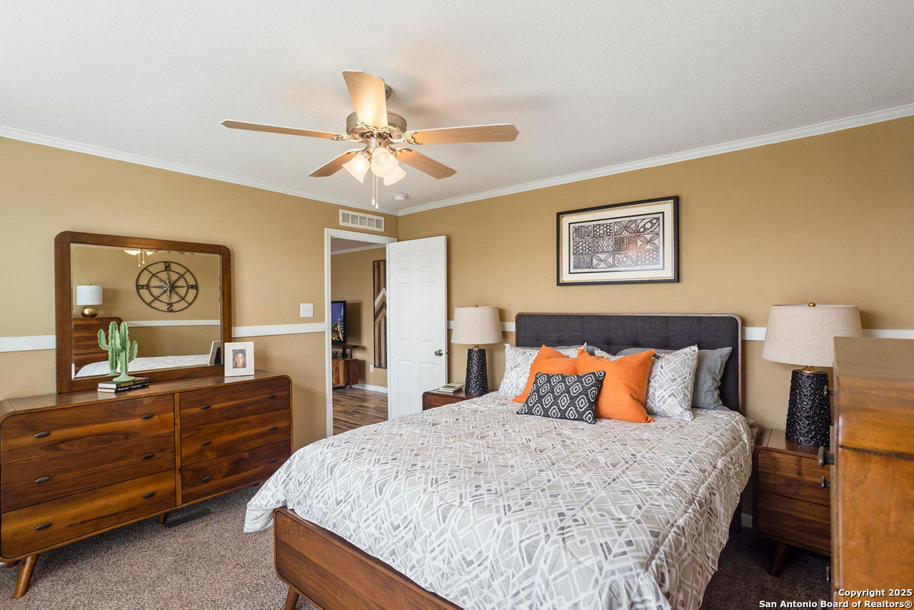 1700 Sandbranch Road Bigfoot, TX 78005 - Photo 9 of 14 a bedroom with a bed and dresser