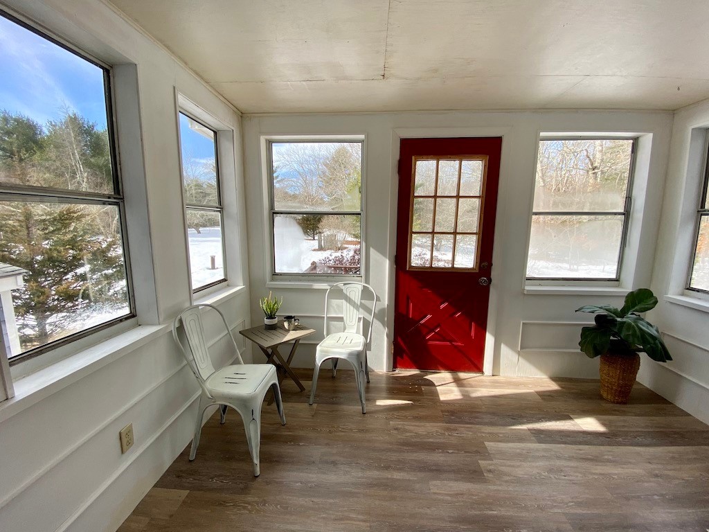 466 Gardiner Road Richmond, RI 02892 - Photo 19 of 48 Sunroom with deck outside the door showing view to yard.