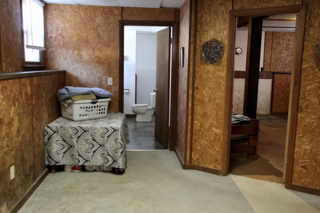 466 Gardiner Road Richmond, RI 02892 - Photo 35 of 48 Basement laundry and 1/2 bath showing extra room with space for wood/pellet stove.