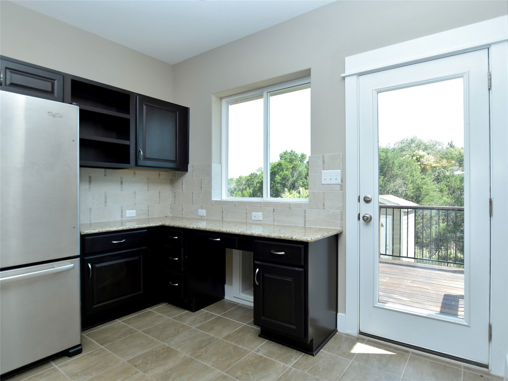 721 Clear Stream Crossing Austin, TX 78753 - Photo 10 of 24 a kitchen with a sink and a window