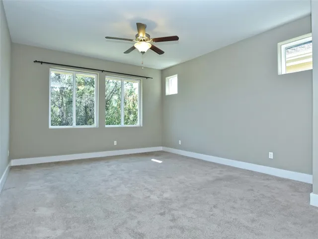 a bathroom with a double vanity sink mirror and shower