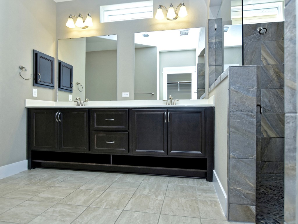 721 Clear Stream Crossing Austin, TX 78753 - Photo 15 of 24 a bathroom with a sink and a mirror