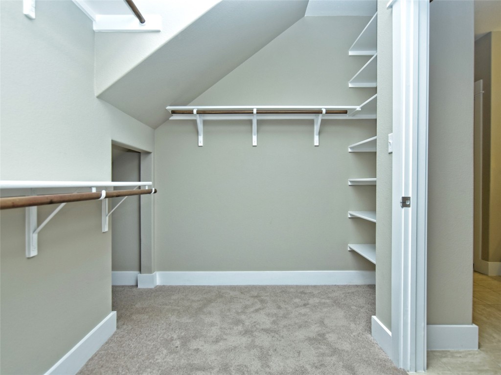 721 Clear Stream Crossing Austin, TX 78753 - Photo 16 of 24 a view of an empty walk in closet