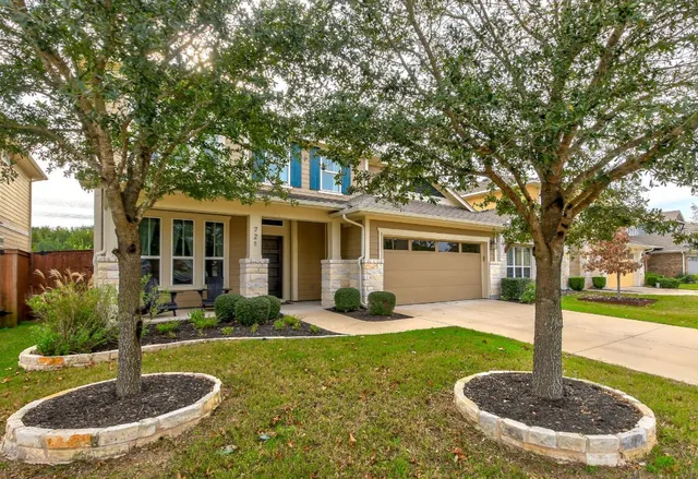 a front view of a house with a yard