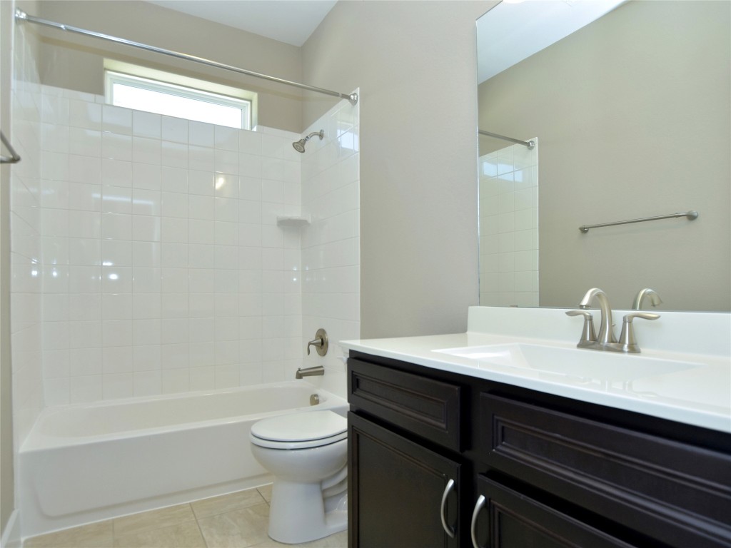 721 Clear Stream Crossing Austin, TX 78753 - Photo 20 of 24 a bathroom with a sink a toilet and shower