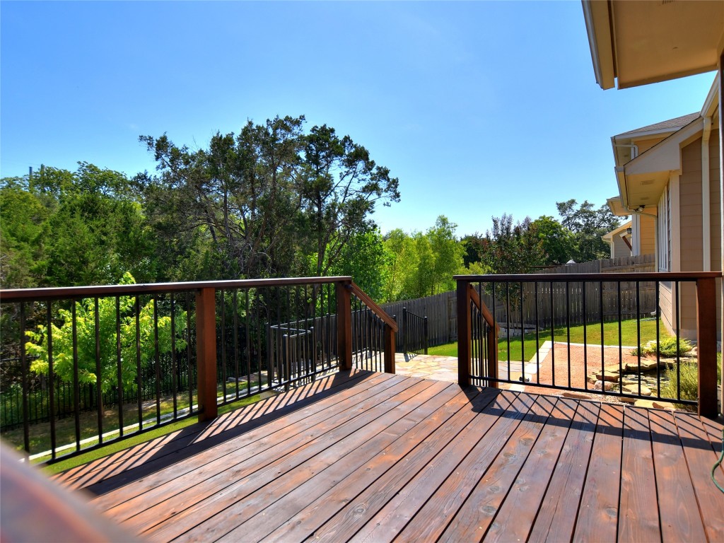 721 Clear Stream Crossing Austin, TX 78753 - Photo 22 of 24 a view of balcony with wooden floor and fence