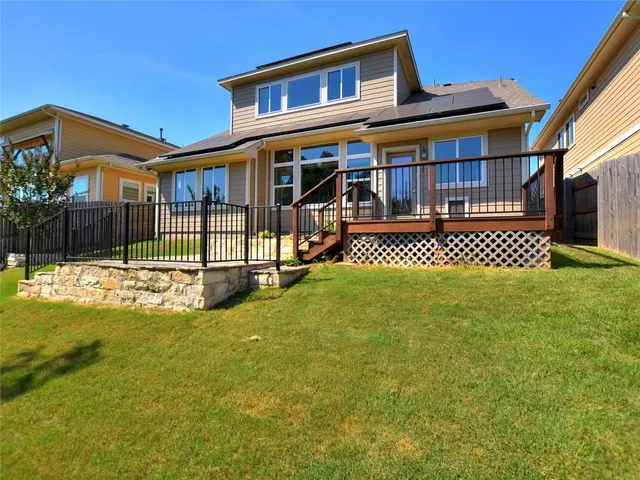 a view of balcony with wooden floor and fence