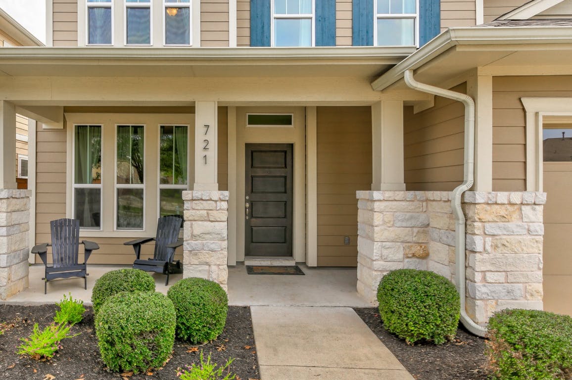 721 Clear Stream Crossing Austin, TX 78753 - Photo 3 of 24 front view of a house with a potted plant