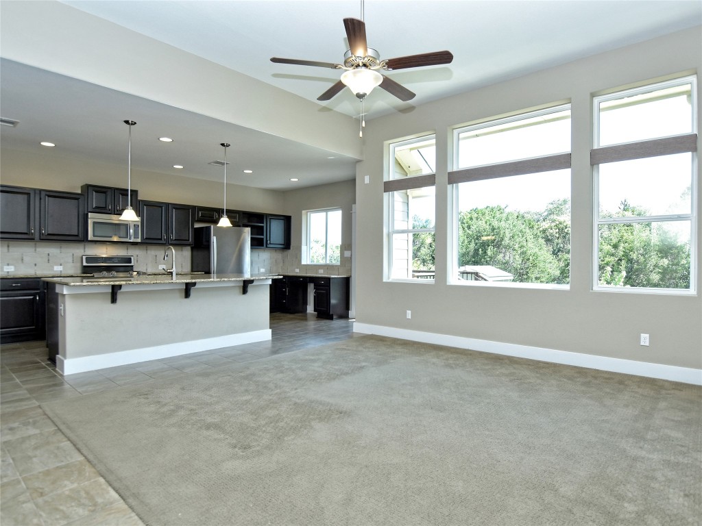 721 Clear Stream Crossing Austin, TX 78753 - Photo 7 of 24 a view of kitchen with refrigerator and window