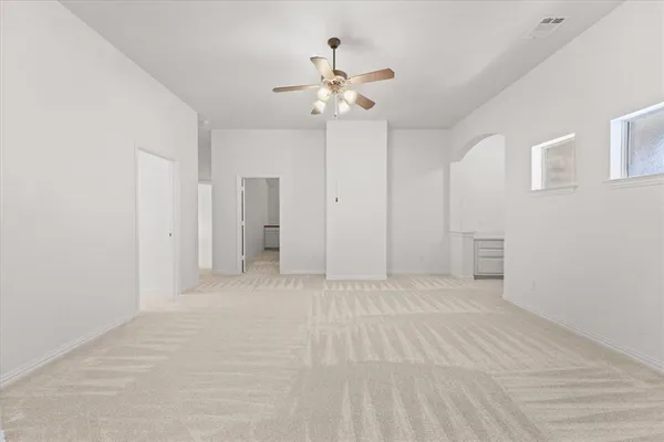 a view of an empty room with a window