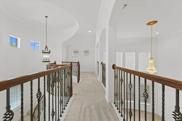 a view of a hallway with stairs