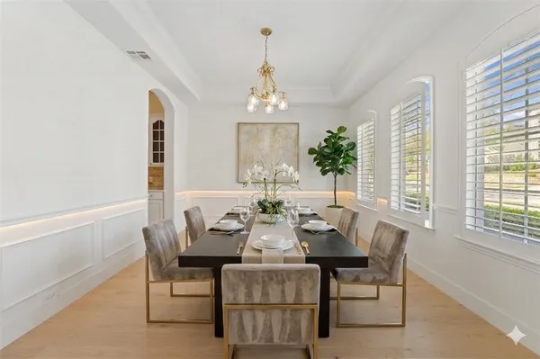 a view of a dining room with furniture and window