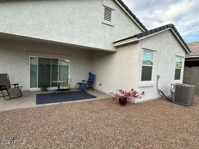 a view of a swimming pool and an outdoor seating