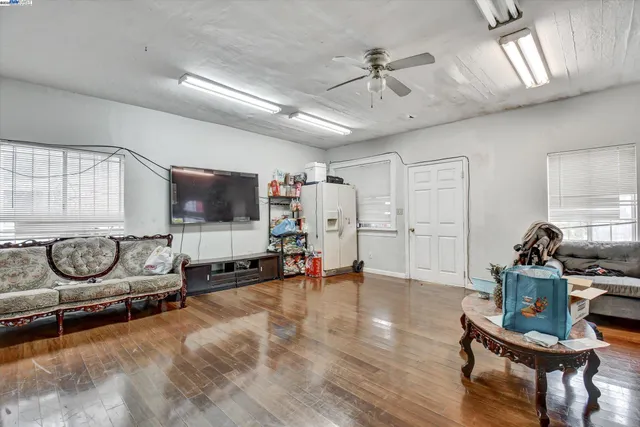 a view of a livingroom with furniture and a flat screen tv