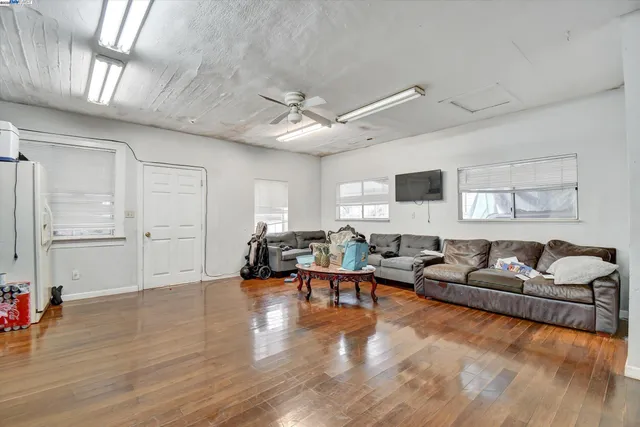 a living room with furniture window and wooden floor