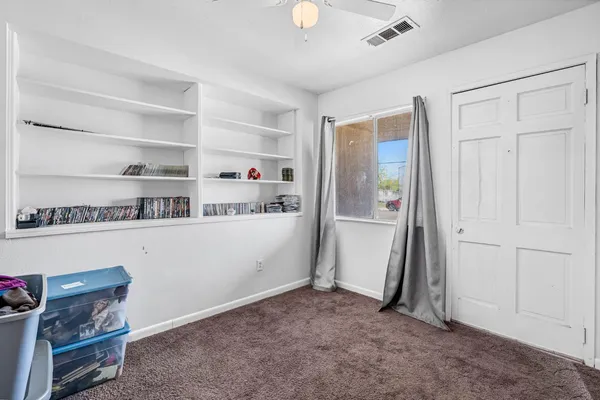 a view of room with furniture and closet