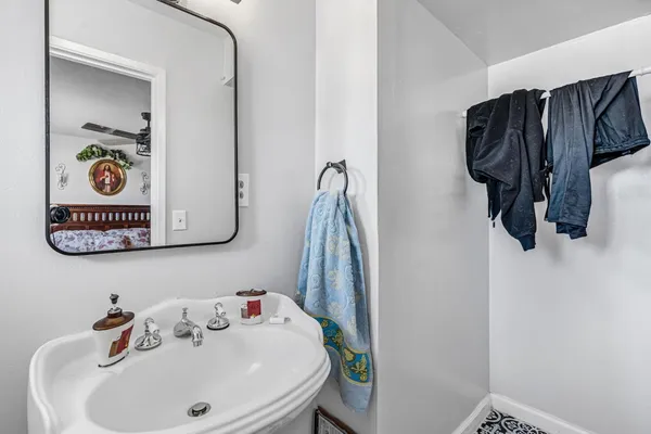 a bathroom with a sink and a mirror