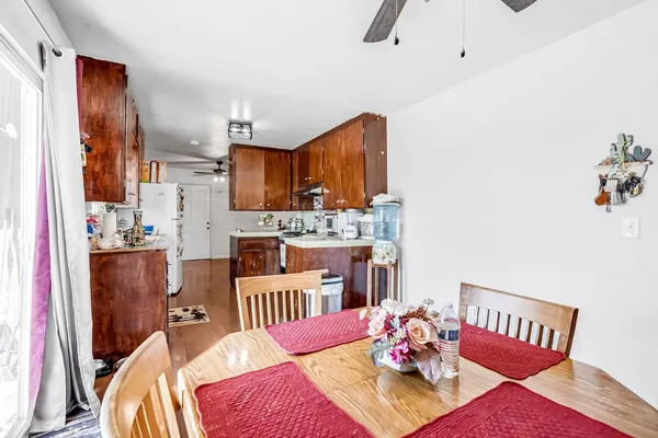 a kitchen with stainless steel appliances granite countertop wooden cabinets sink stove and refrigerator