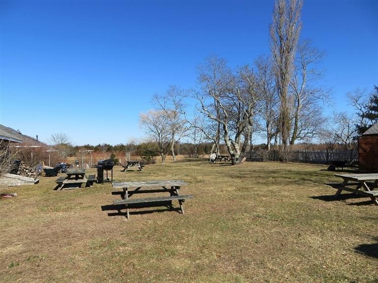 137 Rock Harbor Road, Unit 5 Orleans, MA 02653 - Photo 5 of 13 a view of a park with large trees