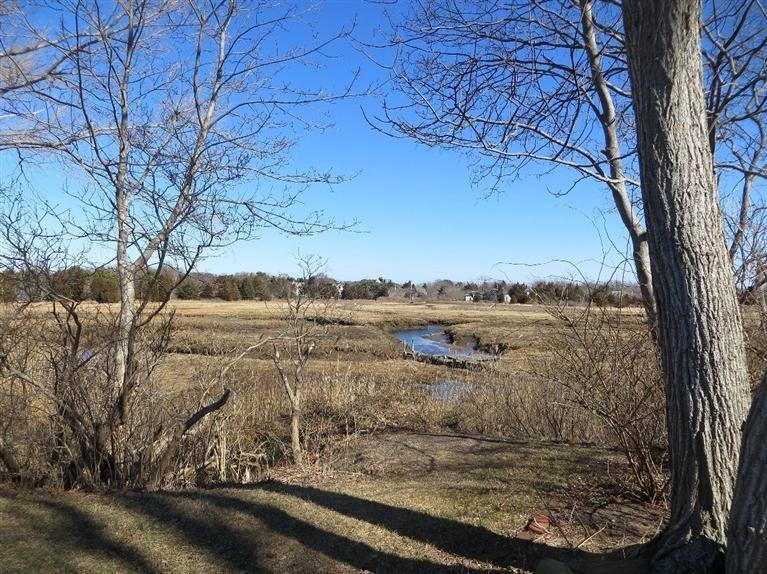 137 Rock Harbor Road, Unit 5 Orleans, MA 02653 - Photo 7 of 13 a view of a yard with wooden fence