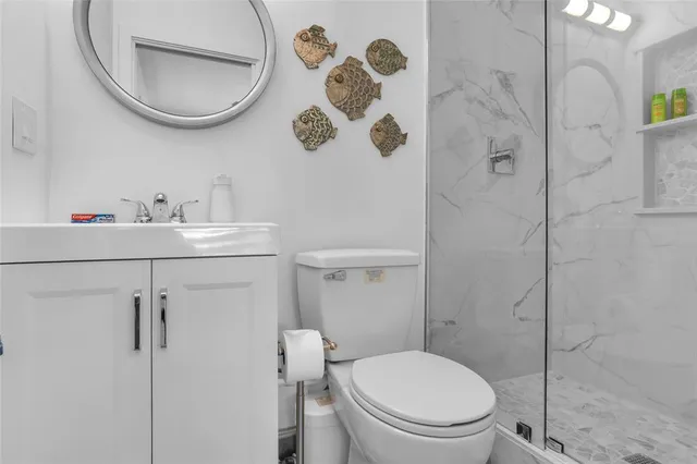 a bathroom with a toilet and a sink