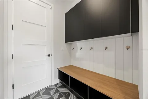 a living room with furniture and a hard wood floor