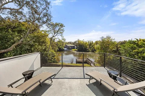 a view of a bathroom with sink mirror and bathtub