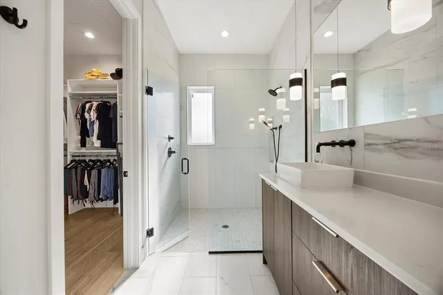 a bedroom with a bed and a night stand