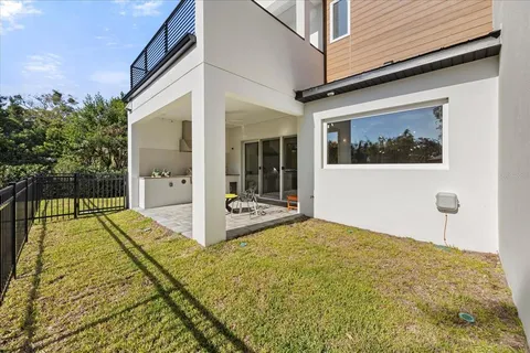 an aerial view of a house with a lake view