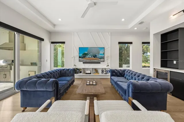 a living room with furniture and a large window