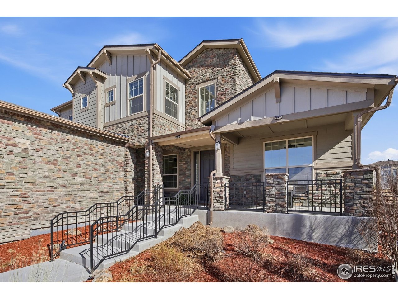 6402 Foothills View Place Fort Collins, CO 80528 - Photo 2 of 50 a front view of a house with parking
