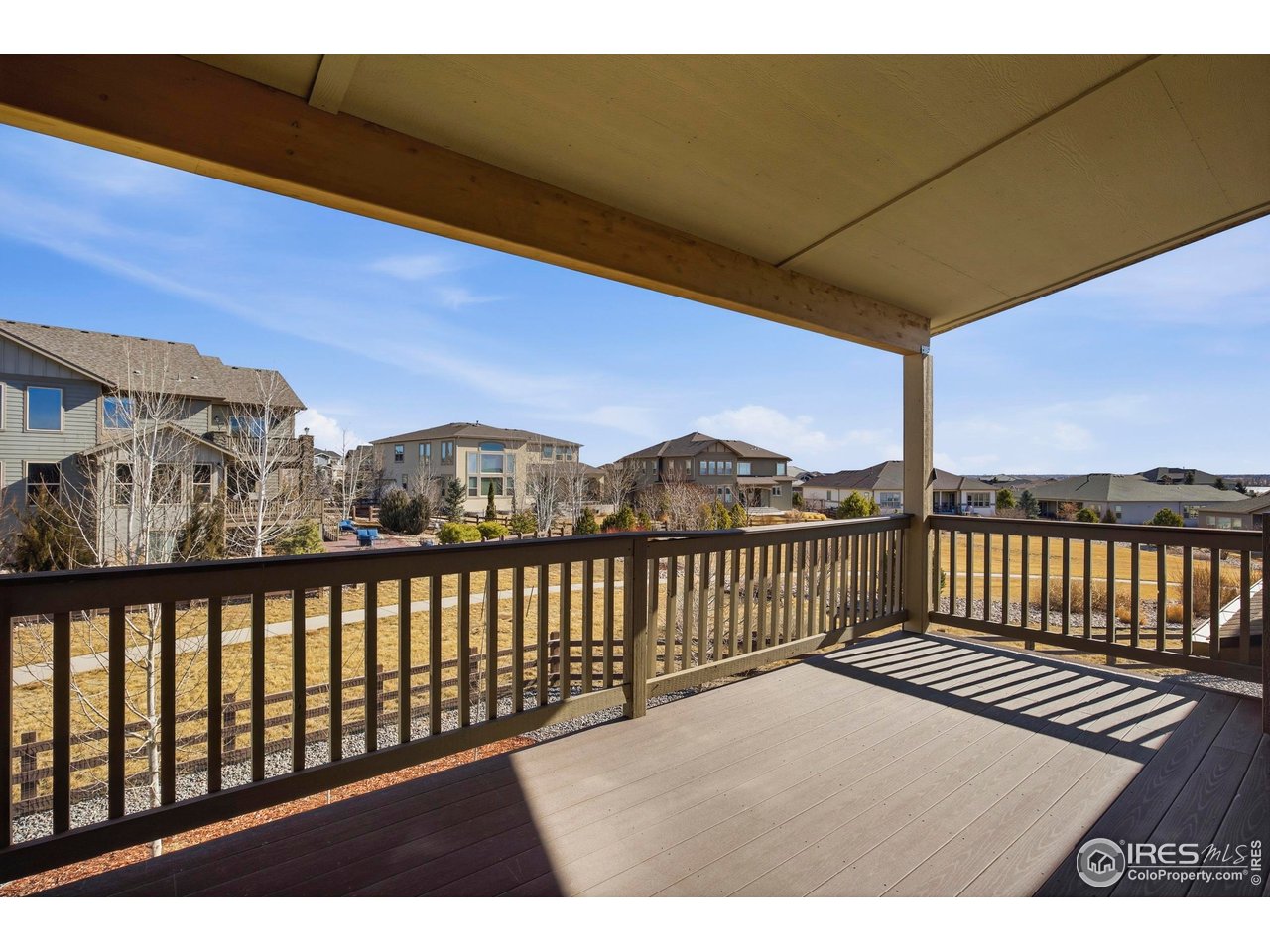 6402 Foothills View Place Fort Collins, CO 80528 - Photo 24 of 50 a view of a balcony with wooden fence