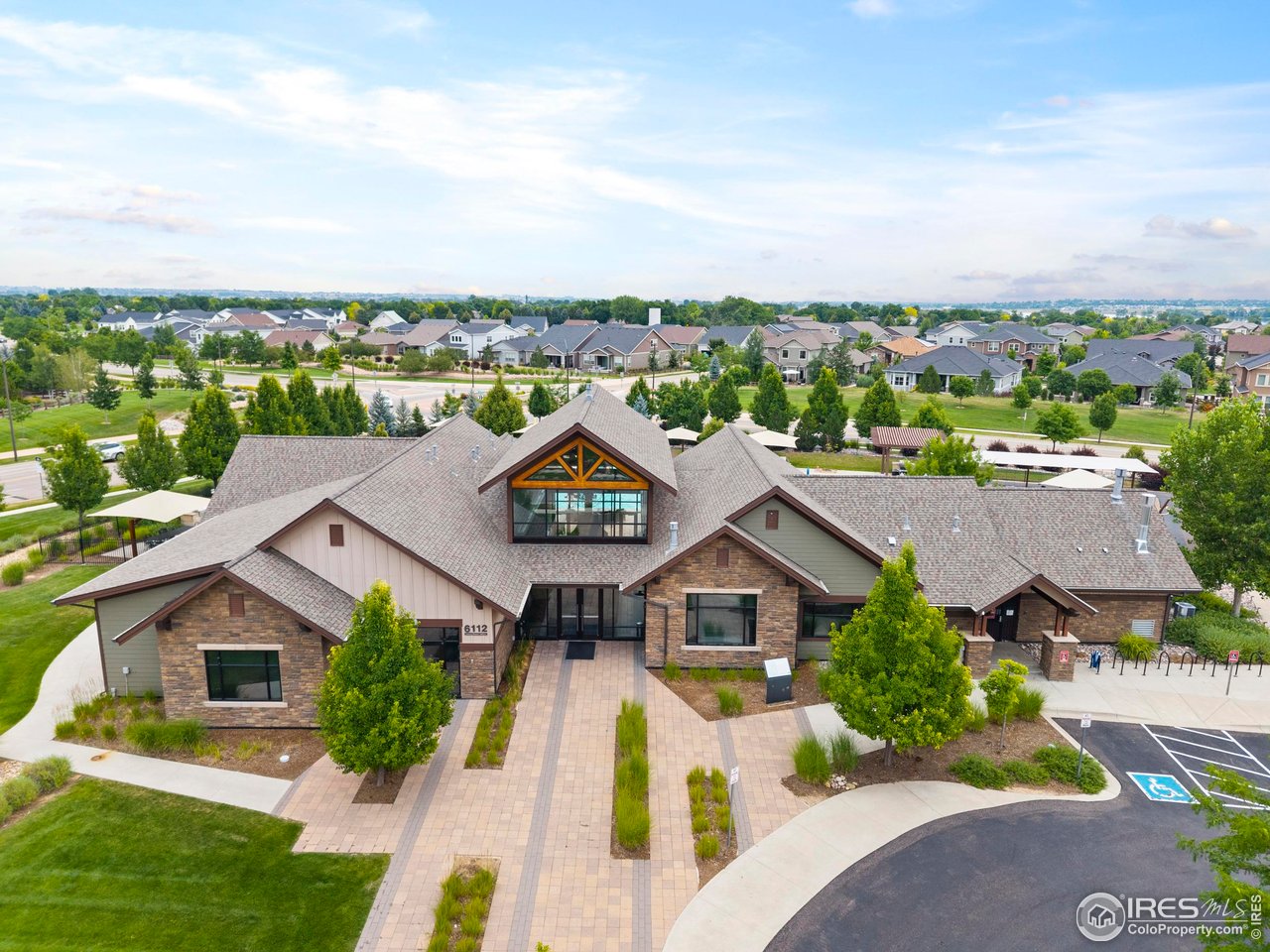 6402 Foothills View Place Fort Collins, CO 80528 - Photo 50 of 50 an aerial view of a house with a big yard and large trees