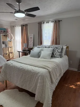 a bedroom with a bed and a table