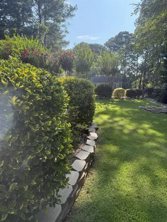 a backyard of a house with lots of green space