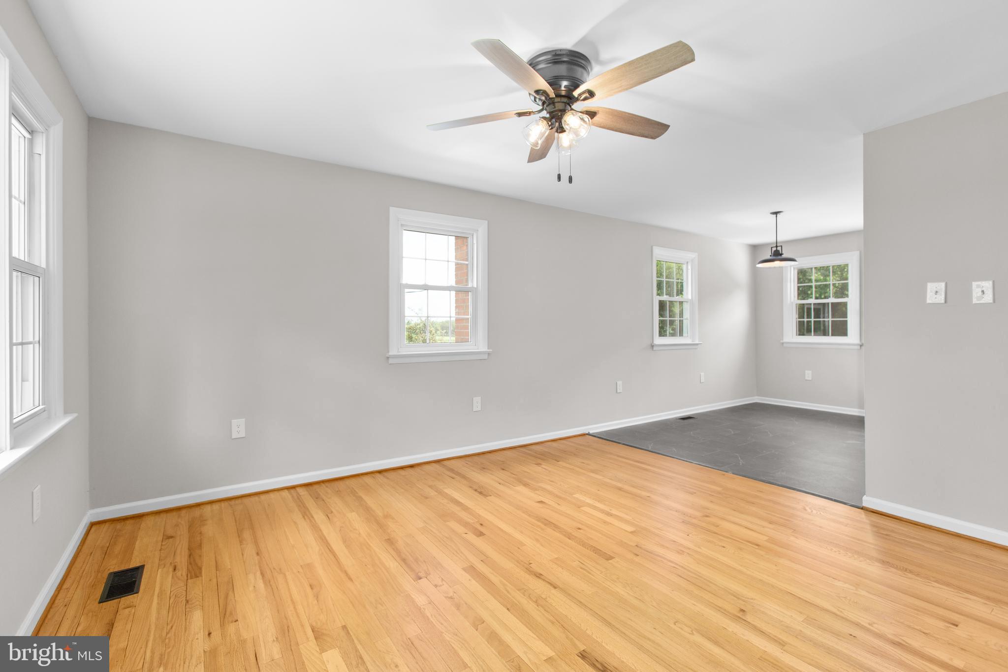 18136 Pepmeier Hill Road Fredericksburg, VA 22408 - Photo 12 of 80 a view of an empty room with a window and wooden floor