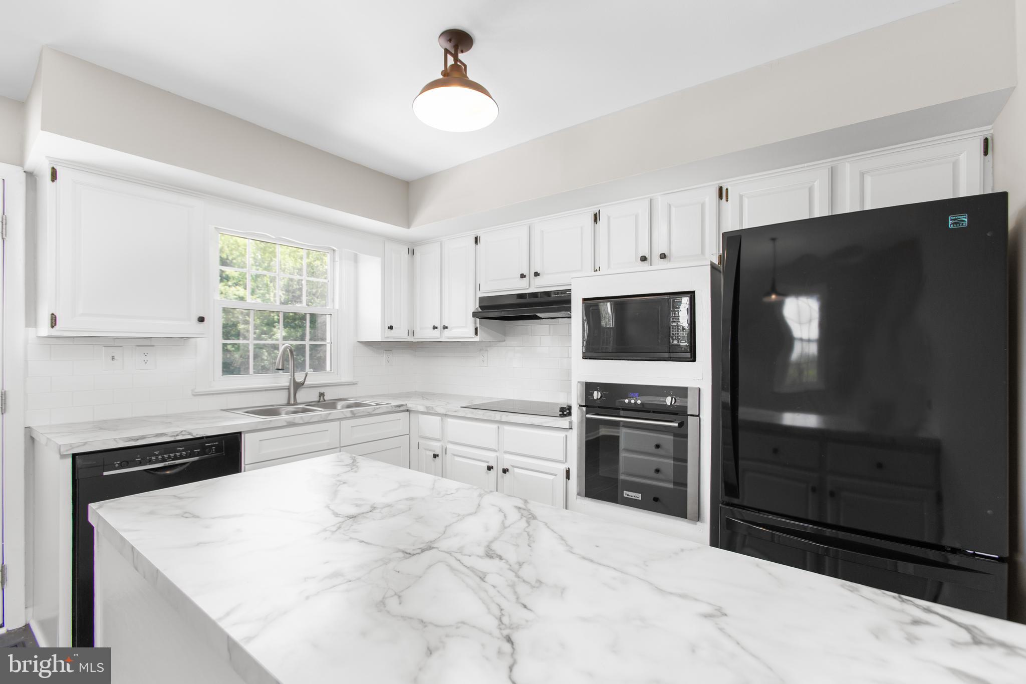 18136 Pepmeier Hill Road Fredericksburg, VA 22408 - Photo 19 of 80 a kitchen with granite countertop a refrigerator stove and sink
