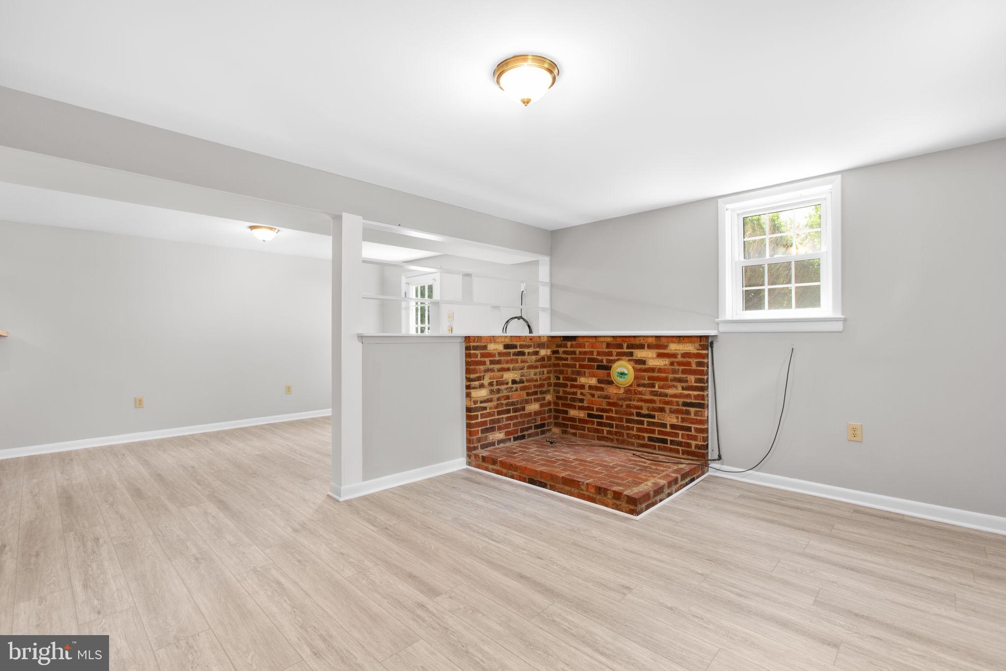 18136 Pepmeier Hill Road Fredericksburg, VA 22408 - Photo 22 of 80 an empty room with wooden floor and windows