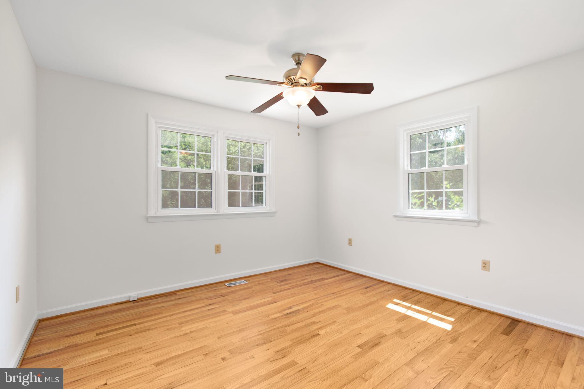 18136 Pepmeier Hill Road Fredericksburg, VA 22408 - Photo 23 of 80 a view of empty room with wooden floor and fan