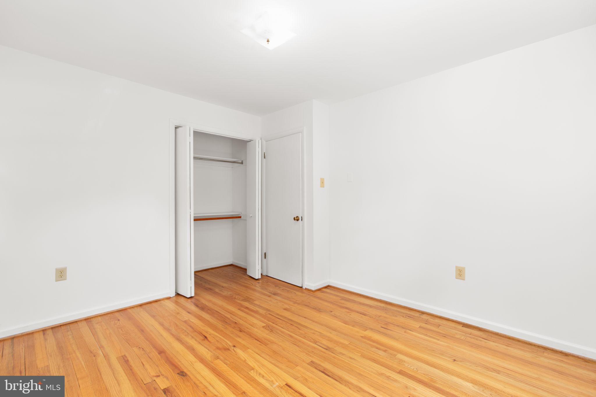 18136 Pepmeier Hill Road Fredericksburg, VA 22408 - Photo 28 of 80 a bedroom with a bed and a wooden floor